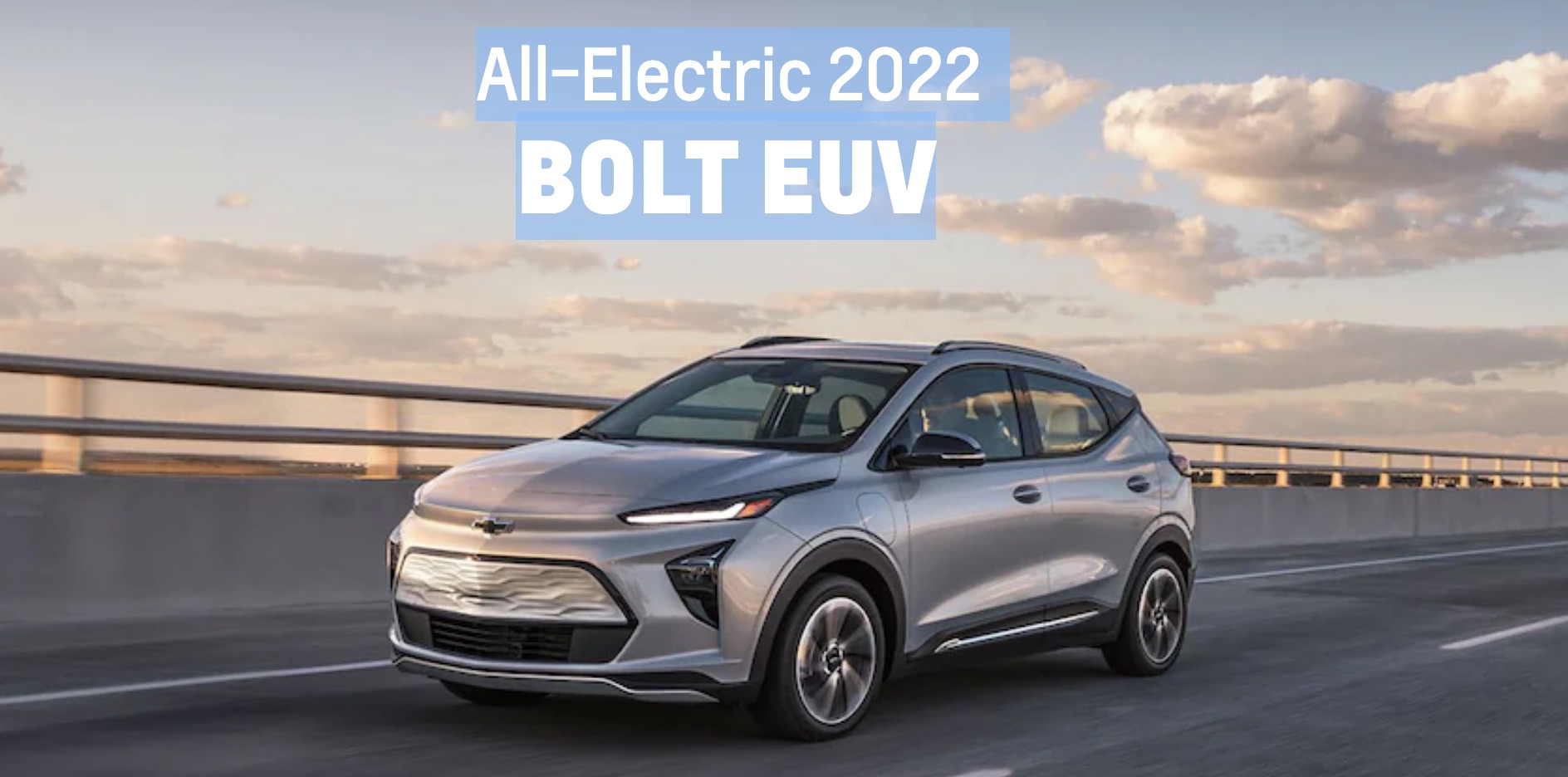 2022 Chevrolet Bolt EUV driving on the interstate with the sun setting in the background.
