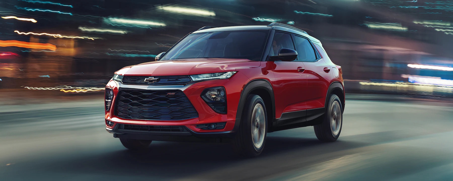 2023 red Chevy Trailblazer driving with a blurred background