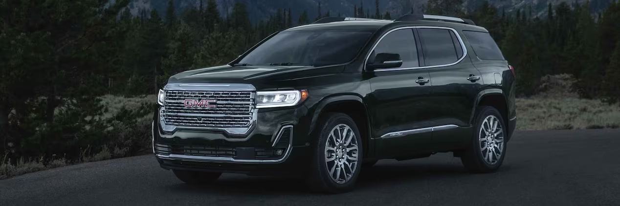 The 2023 GMC Acadia in the road at a three-quarters view