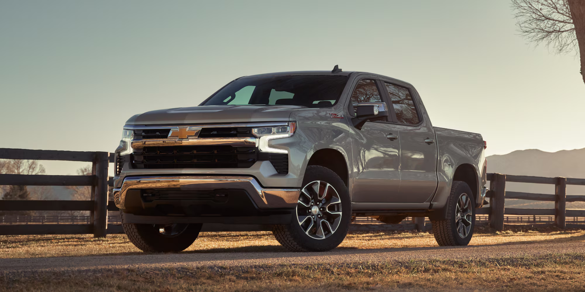 A silver 2025 Chevrolet Silverado 1500 parked on dirt road