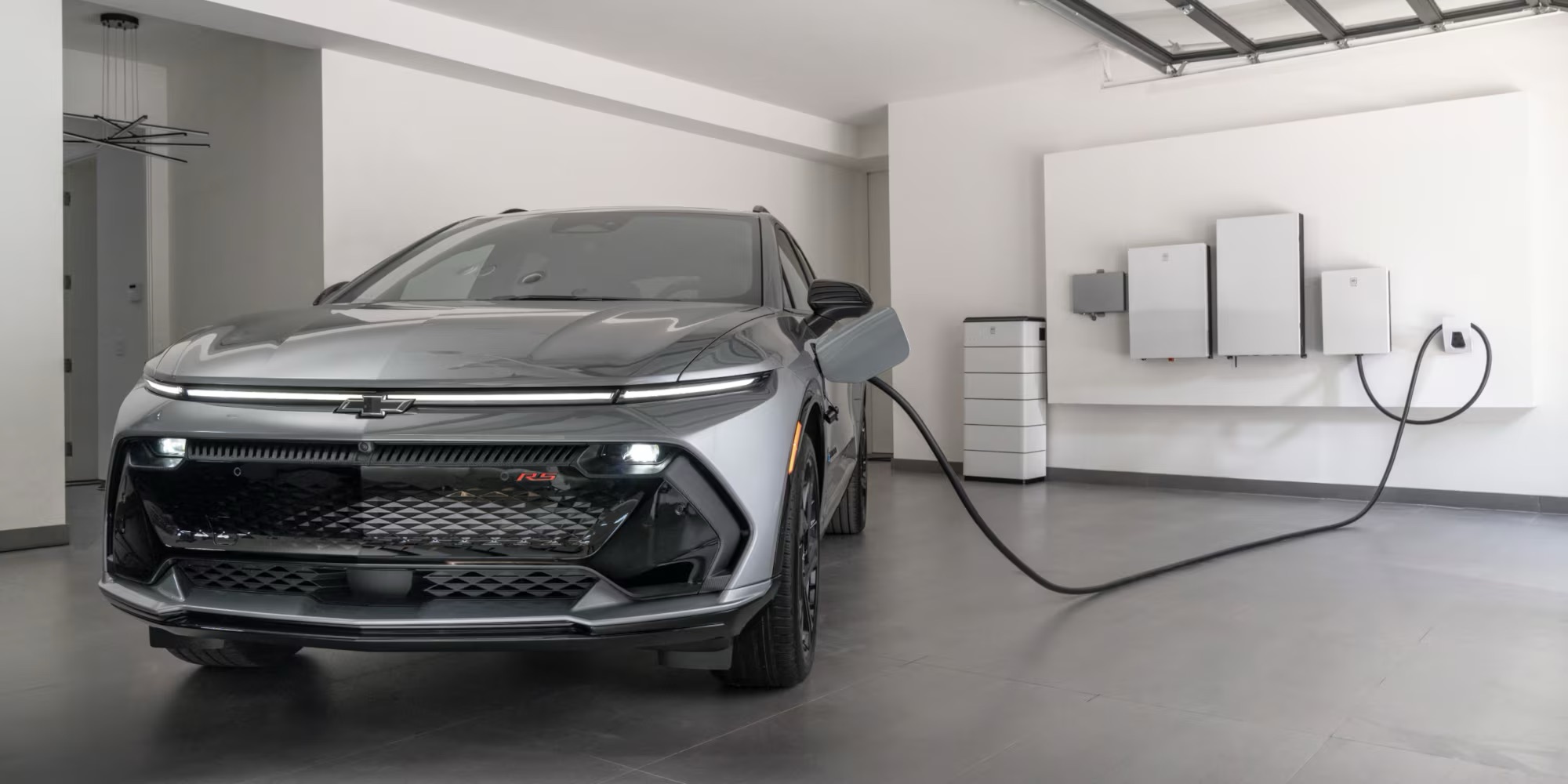 A 2025 Chevy EV charging in garage near Chicago, IL