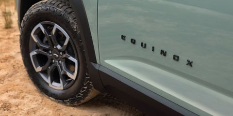 The 2026 Chevy Equinox logo on Green vehicle. | Lou Bachrodt Auto Mall in Rockford IL