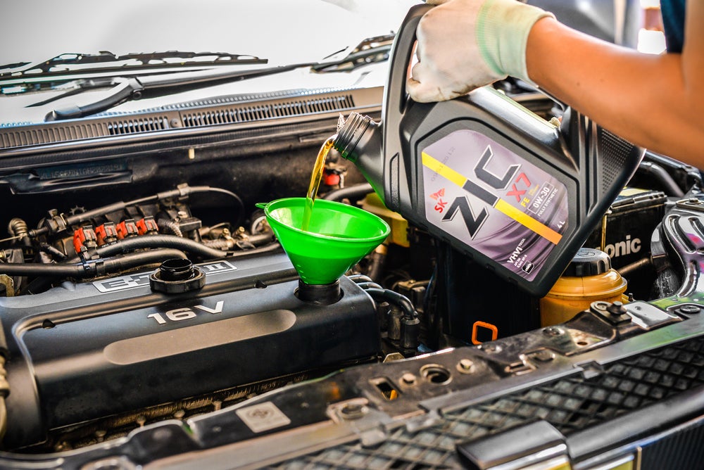 Chevrolet Impala having their oil changed in Rockford, IL at Lou Bachrodt Chevrolet.
